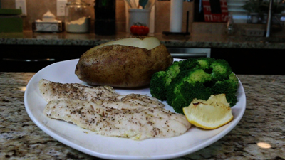 Baked Walleye with garlic baked potato and steamed broccoli