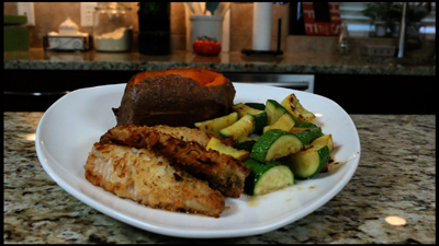 Pan fried Coconut Crusted Perch with baked sweet potato and saut